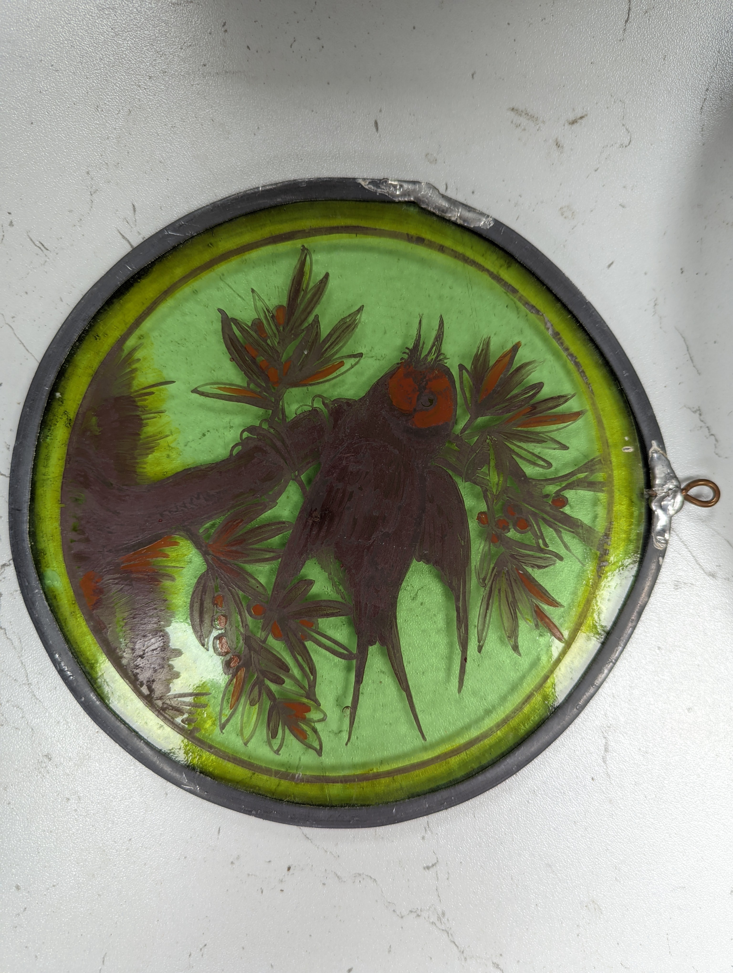 A Victorian stained glass portrait panel, two bird panels and a similar circular bird panel (4)